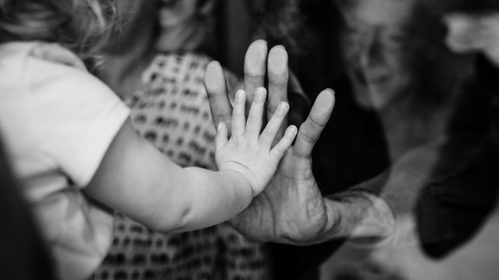 hands through glass